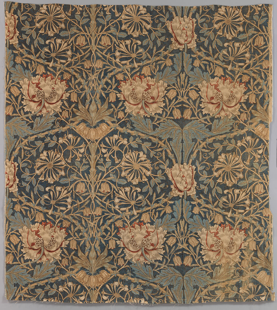 A repeating pattern of flowers and intertwined stems on dark linen.