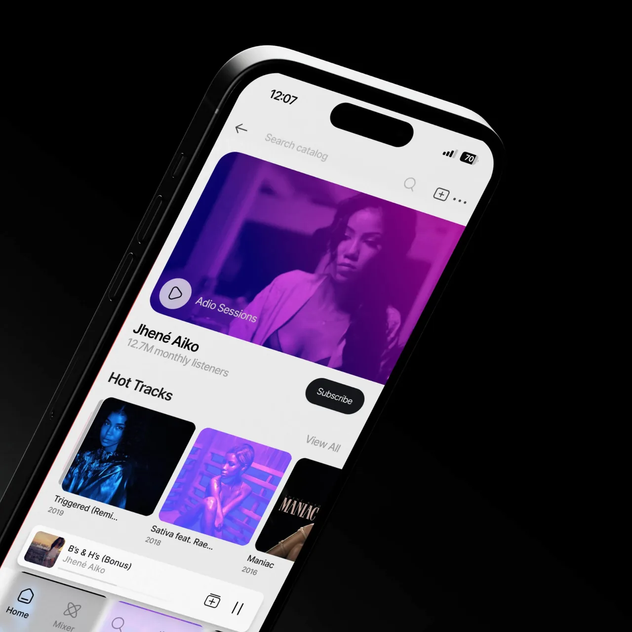 iPhone 16 Pro showing Adio Ai-powered music app screen showing Jhené Aiko’s artist page with music video, hot tracks, and a subscribe button.