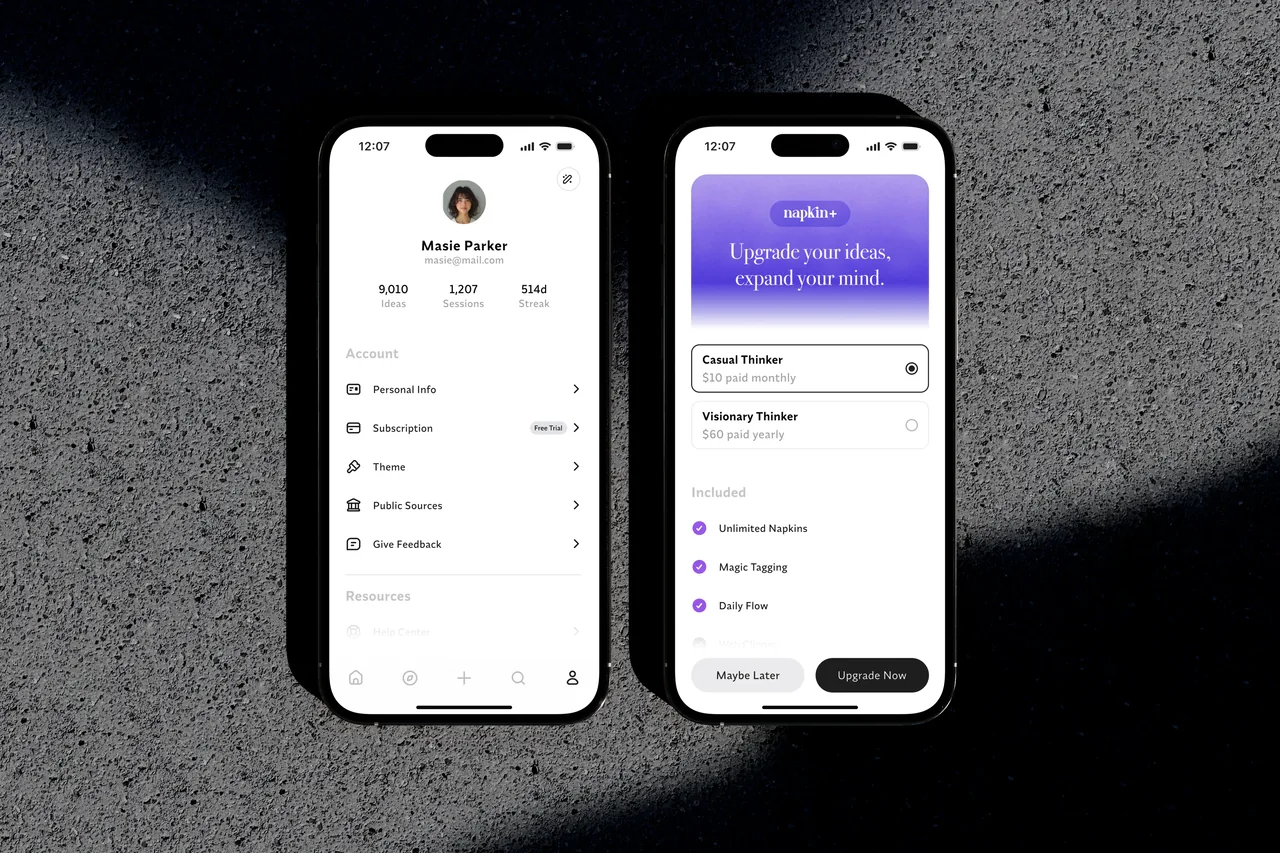 Two iPhone 16s displaying the Napkin app. One shows user profile and settings, the other subscription upgrade options.