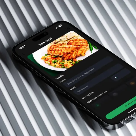 iPhone 15 showing an AI-powered meal logging app with grilled chicken and vegetables entry.